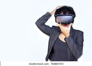 Young Asian business woman holding VR headset glasses device, VR headset concept isolated on white background with copy space. - Shutterstock ID 783807472