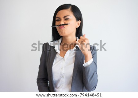 Young Asian Business Woman Playing with Pen