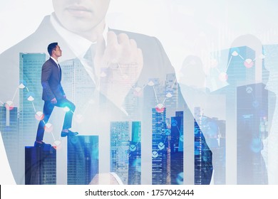 Young Asian businessman climbing bar chart in abstract panoramic city with double exposure of blurry financial graph and business people. Concept of stock market and leadership. Toned image - Powered by Shutterstock