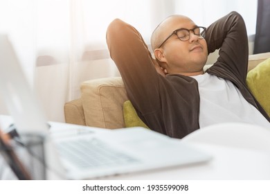 Young Asian Businessman Finish The Job Turn Off Laptop And Take A Rest. Indian Freelancer Finished His Work And Take A Break. He Work At Home.