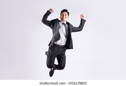 Young Asian Businessman Jumping On White Stock Photo 1956178855 ...