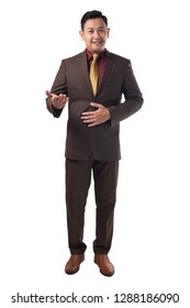 Young Asian Businessman Wearing Brown Formal Suit Talking Forward To Camera, Smiling And Explaining Something, Full Body Portrait Isolated On White