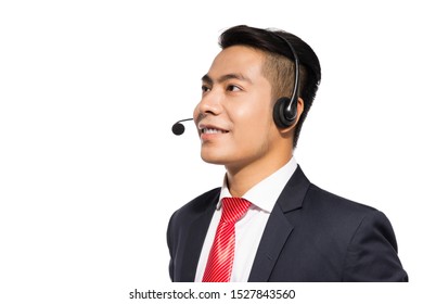 Young asian businessman wearing headset, studio shot.