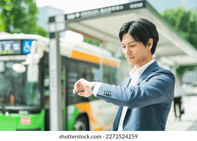 Young Asian businessman working in the business district - Powered by Shutterstock