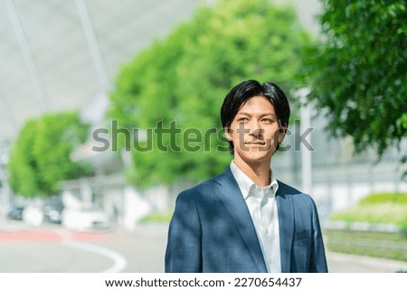 Young Asian businessman working in the business district