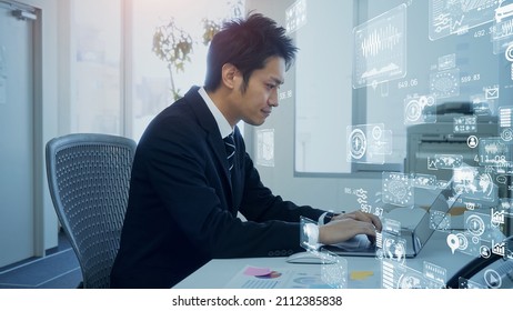 Young Asian Businessman Working In The Office. System Engineer. Digital Transformation.