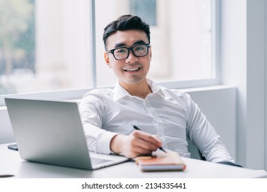 Young Asian Businessman Working At Office