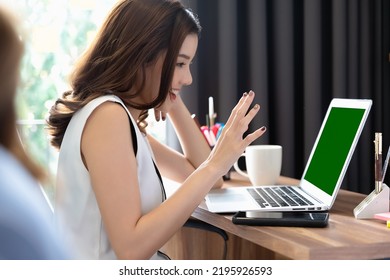 Young Asian Businesswoman Having Conversation Chatting While Using Green Screen Laptop At House. Work At Home, Video Conference, Online Meeting Video Call, Virtual Meeting, Remote Learning, E-learning