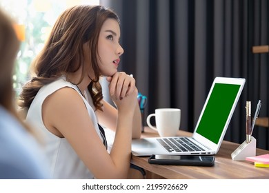 Young Asian Businesswoman Having Conversation Chatting While Using Green Screen Laptop At House. Work At Home, Video Conference, Online Meeting Video Call, Virtual Meeting, Remote Learning, E-learning