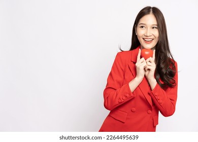 Young Asian businesswoman holding red heart isolated on white background - Shutterstock ID 2264495639