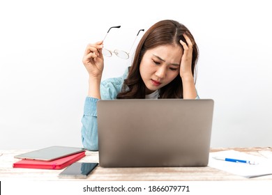 Young Asian Businesswoman Is Stressed, Does Not Understand, Or Has Problems While Working On A Laptop At Home. Concept Of Hard-working And No Time To Take A Rest.