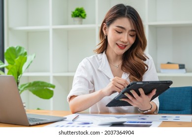 Young Asian Businesswoman Using Tablet With Smiling Face, Positive Emotion, At Office, Casual Office Life Concept