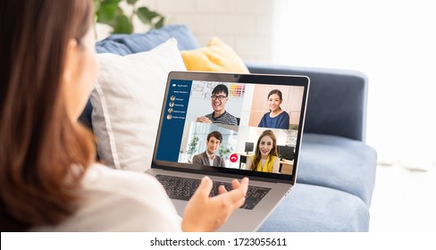Young Asian businesswoman work at home and virtual video conference meeting with colleagues business people, online working, video call due to social distancing at home office - Shutterstock ID 1723055611