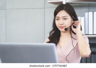 Young Asian busineswoman in headphone with computer pc having online vdo conference meeting at office,Telework concept - Shutterstock ID 1797765487