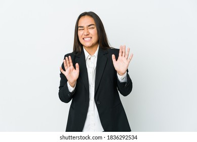 Young Asian Bussines Woman Isolated On White Background Rejecting Someone Showing A Gesture Of Disgust.