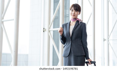 Young Asian Cabin Crew Walking