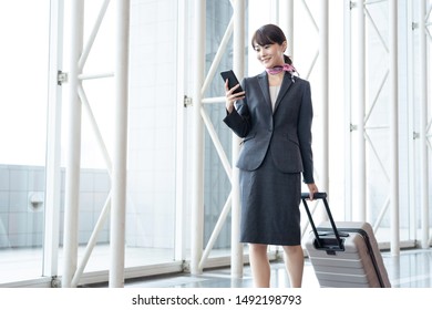 Young Asian Cabin Crew Walking