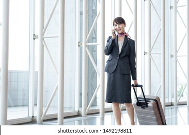 Young Asian Cabin Crew Walking