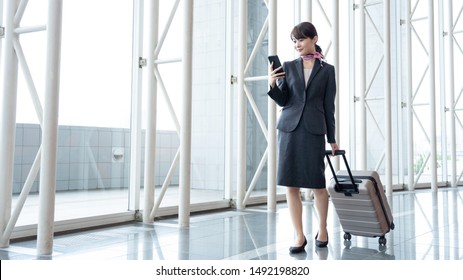 Young Asian Cabin Crew Walking