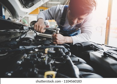 Young Asian Car Mechanic Working At Service Center Repair