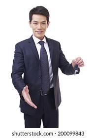 Young Asian Car Salesman Holding Car Key, Isolated On White.