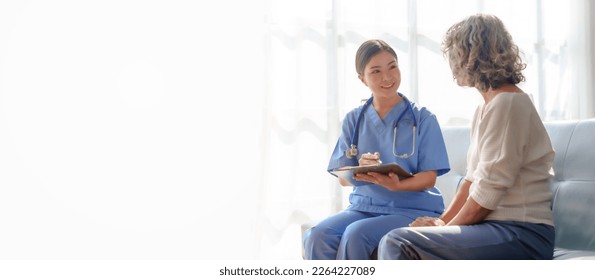 Young asian caretaker with 60s asia elderly woman consulting and encourage, take a history and recommend the right treatment to live happily in retirement, Taking a patient's history - Powered by Shutterstock