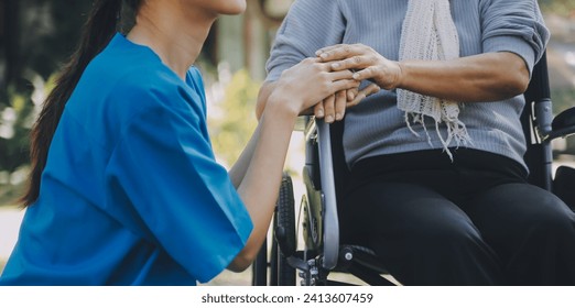 Young asian caretaker with 60s asia elderly woman consulting and encourage, take a history and recommend the right treatment to live happily in retirement, holding hands and encouraging - Powered by Shutterstock