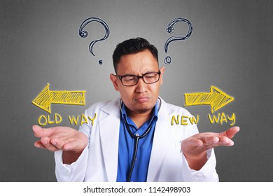 A Young Asian Confused Doctor Trying To Decide Which Side To Choose, Old Way Or New Way