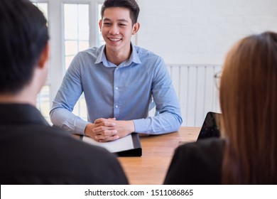 Young Asian Couple Consulting Financial Advisor,broker Consulting Spouses At The Office.