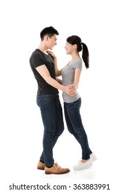 Young Asian Couple Dancing With Smiling Face.