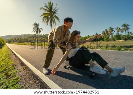 Similar – Image, Stock Photo Surfskateboarding in a sitting position