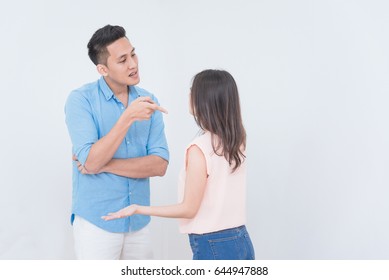 Young Asian Couple Having Argument And Quarrelling With Each Other Man Complaining To His Wife.