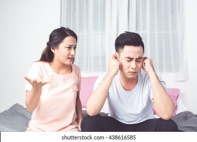 Young Asian Couple Mad At Each Other In Their Home