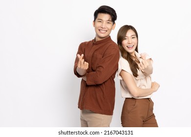 Young Asian Couple Showing Mini Heart Sign Isolated On White Background, Spreading Love And Happiness Concept