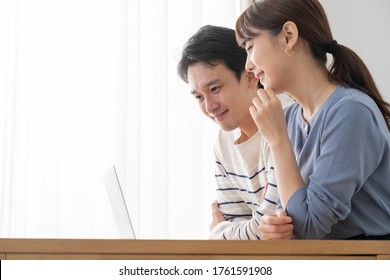 young asian couple talking in the room