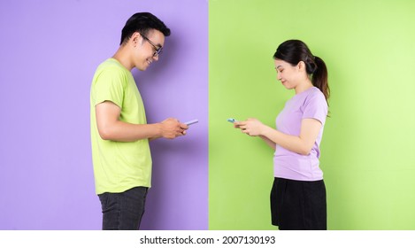 Young Asian Couple Using Smartphone, Long Distance Love Concept
