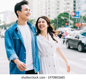 Young Asian couple walking on the street