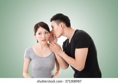 Young Asian Couple Whisper, Closeup Portrait.