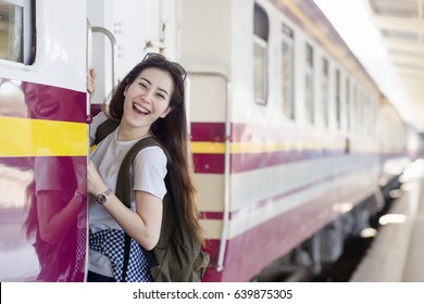 Young Asian Cute Woman Is Hanging And Smiling At Platform Train Station. Travel Summer Concept.