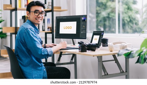 Young Asian Designer Working At Office