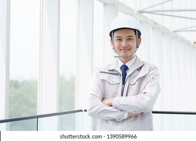 Young Asian Engineer Working In Building