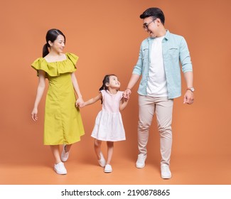 Young Asian family posing on background - Shutterstock ID 2190878865