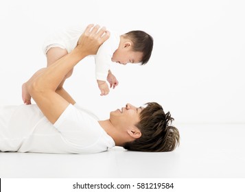 Young Asian Father Holding Sweet Baby Boy