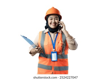 Young Asian female construction worker in hijab confidently making a voice call while carrying a clipboard, industrial and construction concept, isolated white background. - Powered by Shutterstock