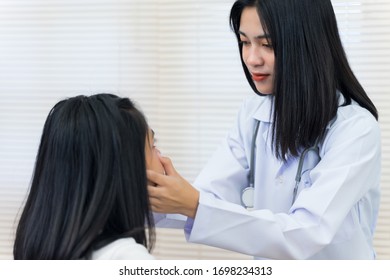 Young Asian Female Doctor Checks Adult Stock Photo 1698234313 ...