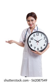 Young Asian female doctor smile with a clock and pills in hand  isolated on white background.