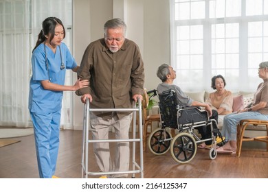 Young Asian Female Nurse Care Giver Helping Asian Senior Old Man With Mobility Walker In Living Area Of Nursing Home Senior Daycare Center,Nurse Take Care Elderly Patient With Cheerful Concentrate