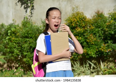 Young Asian Female Student With The Flu Wearing Bookbag