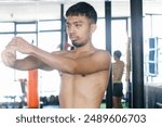 Young Asian Figther Man In Sportswear Stretching Arms With Holding Elbow Before Workout