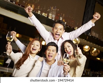 Young Asian Friends Couples Enjoying Party In Pub
